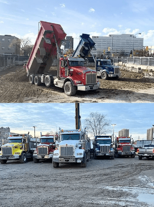 Heavy haulage truck loaded with construction materials, parked on a job site, representing the transportation aspect of excavation and demolition services in the GTA.