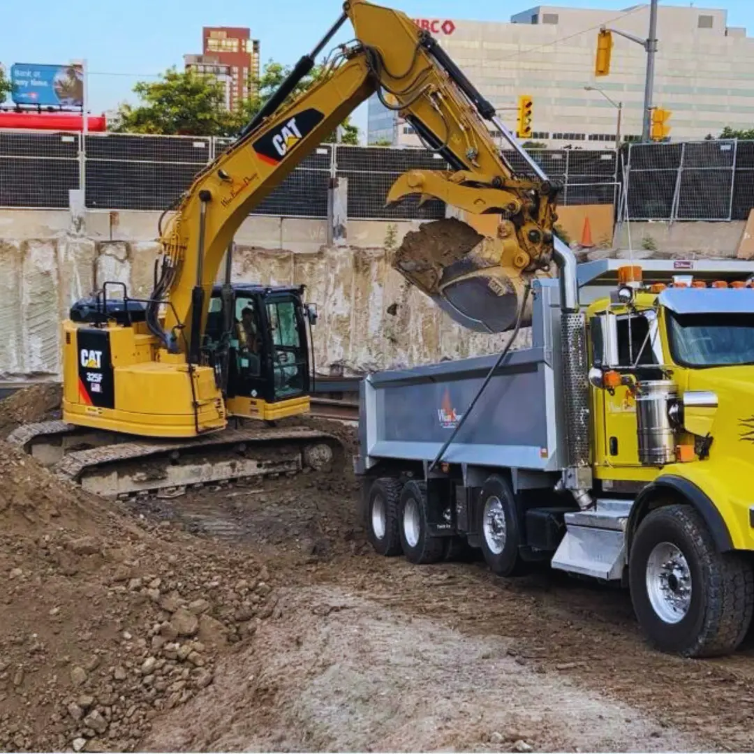 Fine for building without a permit in Ontario: Wallace Excavation & Demolition crew excavating a permitted site in Toronto